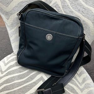 Coach camera bag has a 2ft adjustable strap.  Slightly worn.